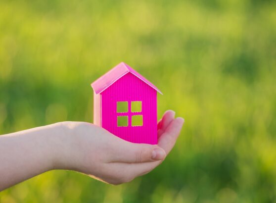 paper house in hand outdoor